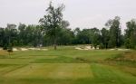 Palmer design channels Jack Nicklaus with a tree dead center on the 13th hole.