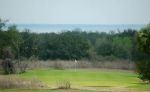 The 7th green at Sugarloaf, with Lake Apopka beyond.